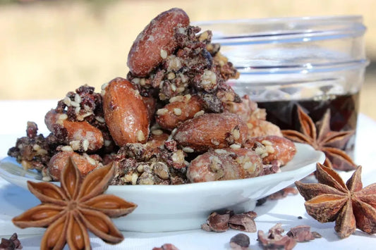 A small plate of Maple Sesame Cacao Beans with Anise stars