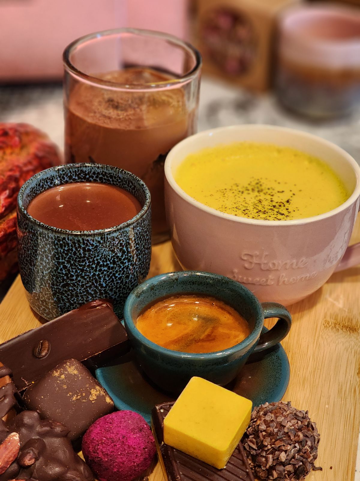 espresso, golden milk, and ceremonial cacao with chocolates